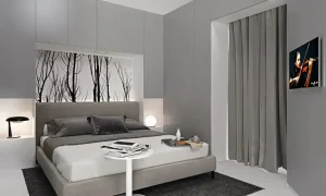 camera da letto moderna fatta su misura con un armadio a ponte per sfruttare tutto lo spazio disponibile